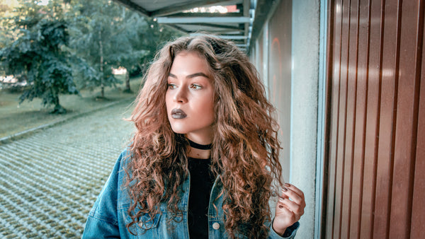 Dark lips with curly hair